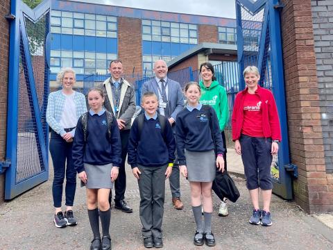Pictured (L-R) Dr Hannah McCourt, Senior Health and Social Wellbeing Improvement Officer at Public Health Agency (PHA), Craig Bradley, Vice Principal and Active School Travel Champion at Glenwood Primary School, Wesley Wright, Principal at Glenwood Primary School, Beth Harding, Active School Travel Manager at Sustrans, Beverley Gaston, Active Travel Officer at Sustrans and pupils from Glenwood Primary School.